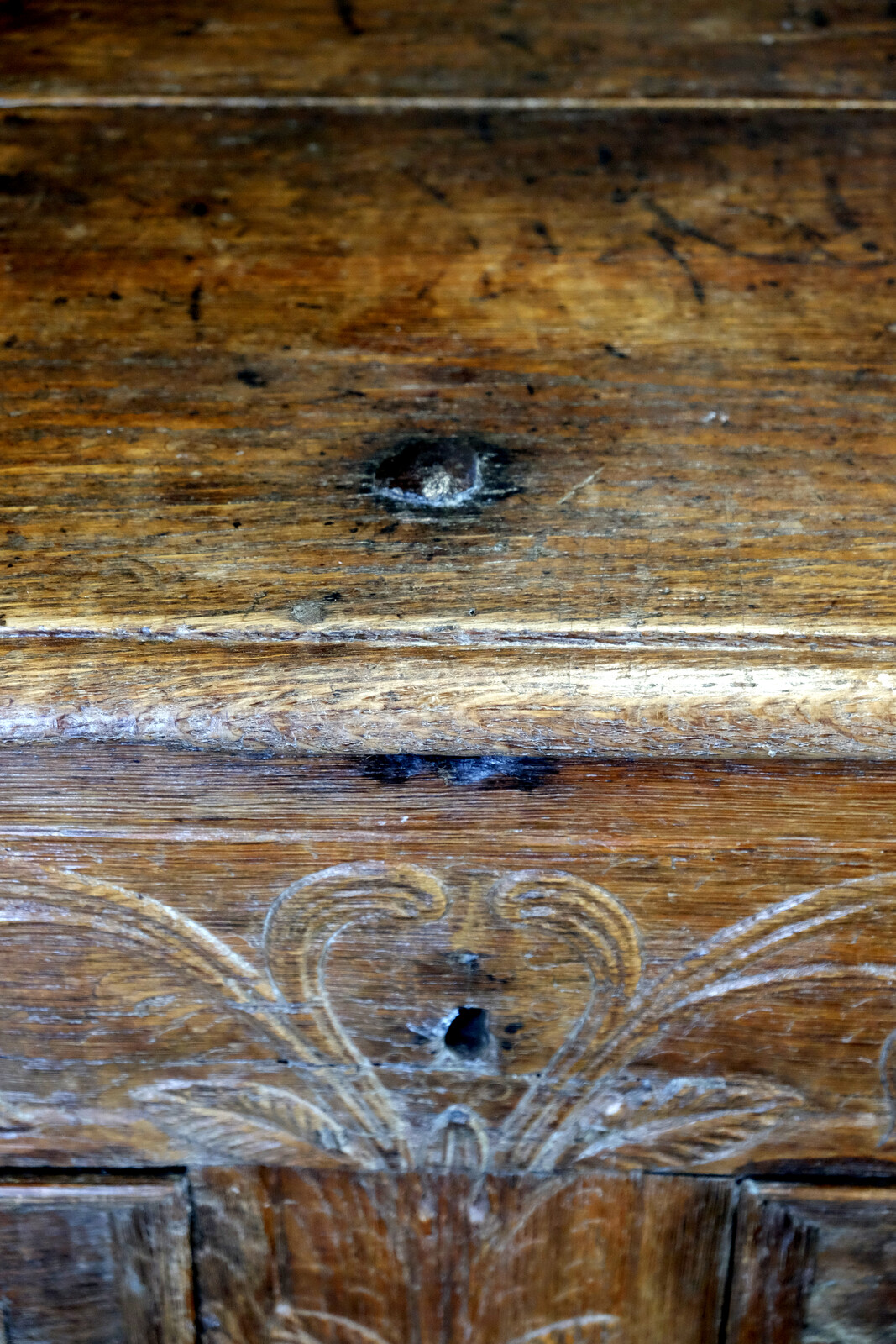 18th century oak chest with interesting carving.