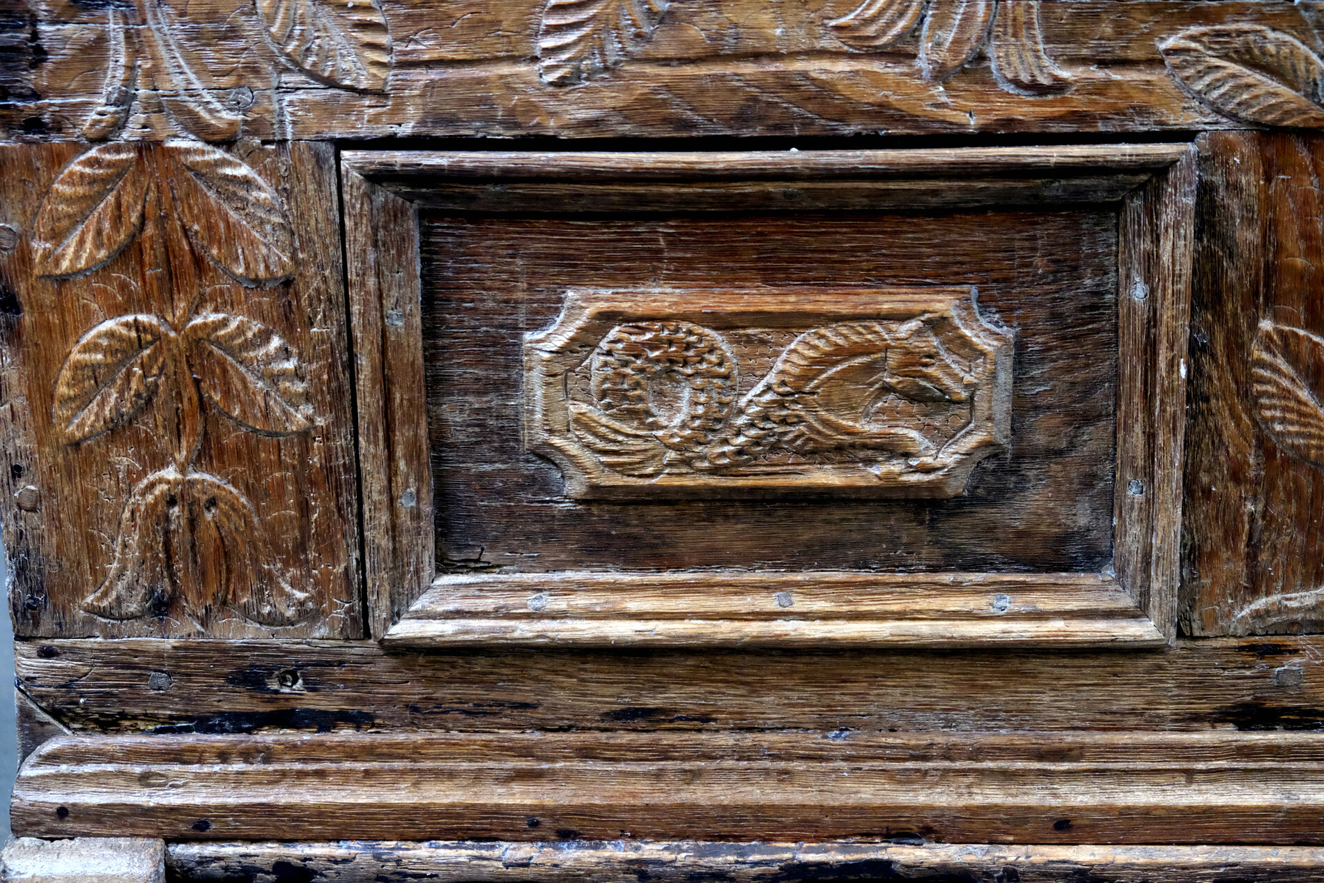 18th century oak chest with interesting carving.