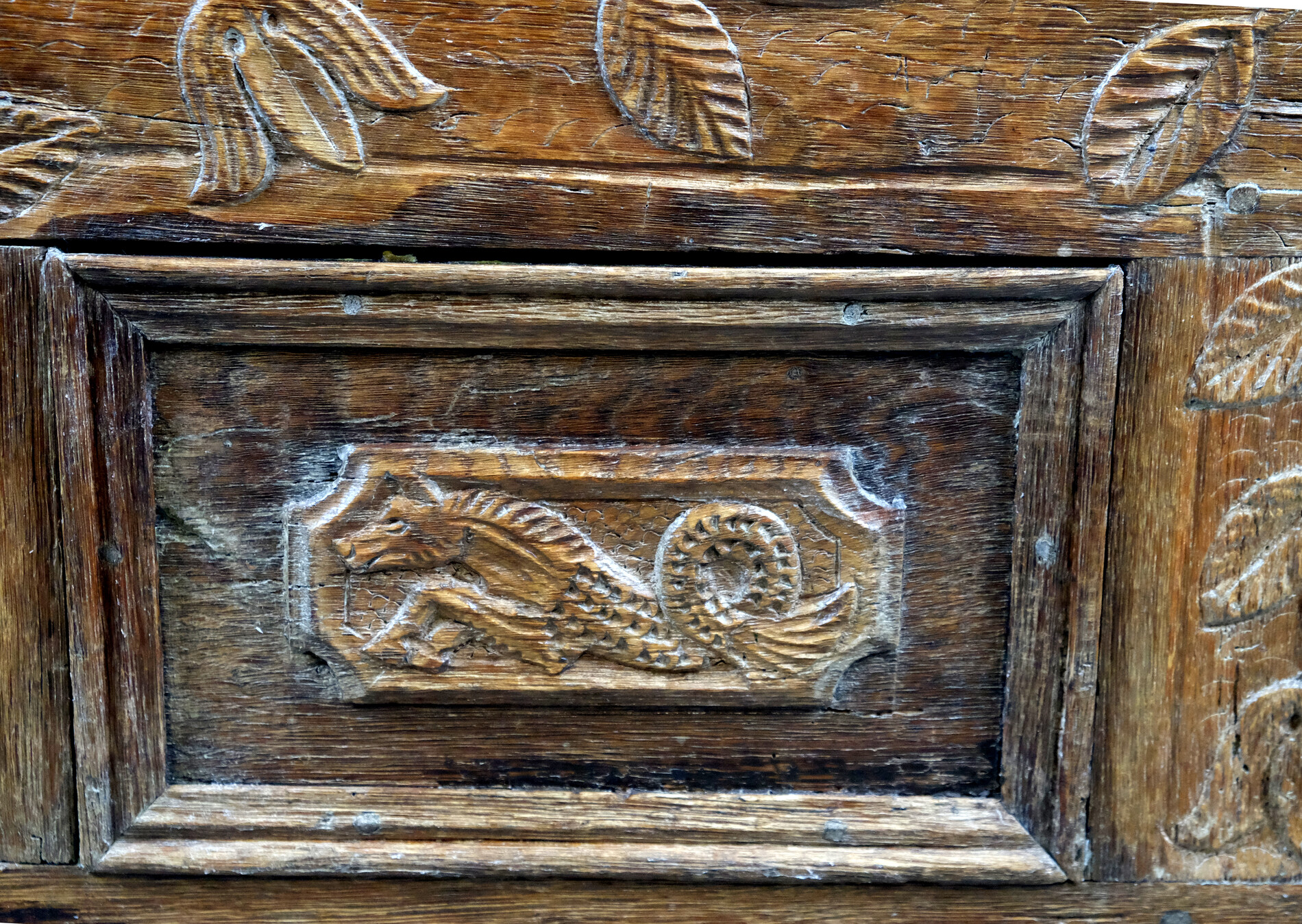 18th century oak chest with interesting carving.