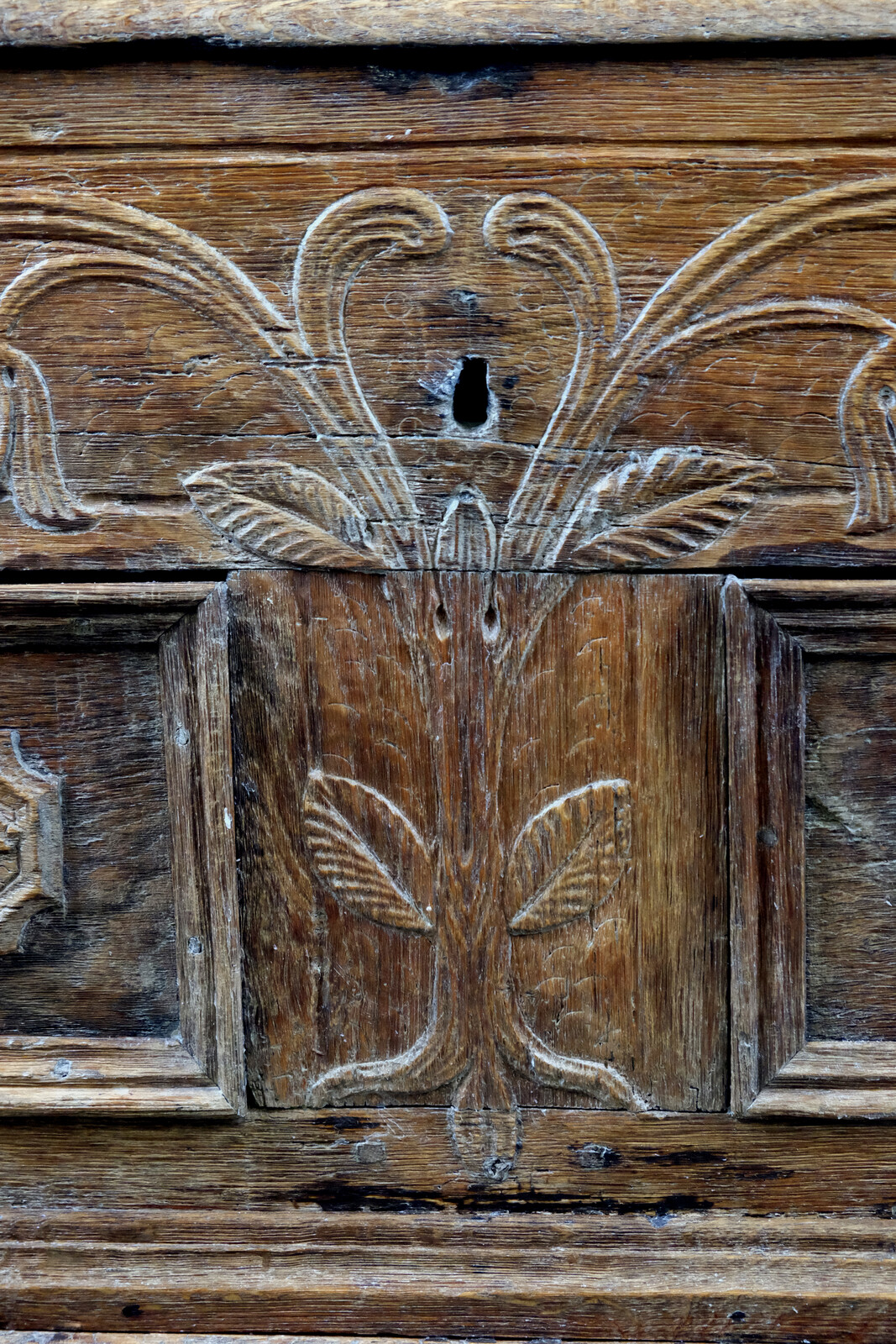 18th century oak chest with interesting carving.